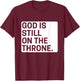 God is still on the throne.. T-Shirt - T-Shirt | Maroon