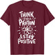 Think Like A Proton And Stay Positive Science Gift T-Shirt - T-Shirt | Maroon