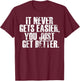 Motivational - It Never Gets Easier You Just Get Better T-Shirt - T-Shirt | Maroon