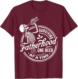 Surviving Fatherhood One Beer At A Time Funny Fathers Day T-Shirt - T-Shirt | Maroon