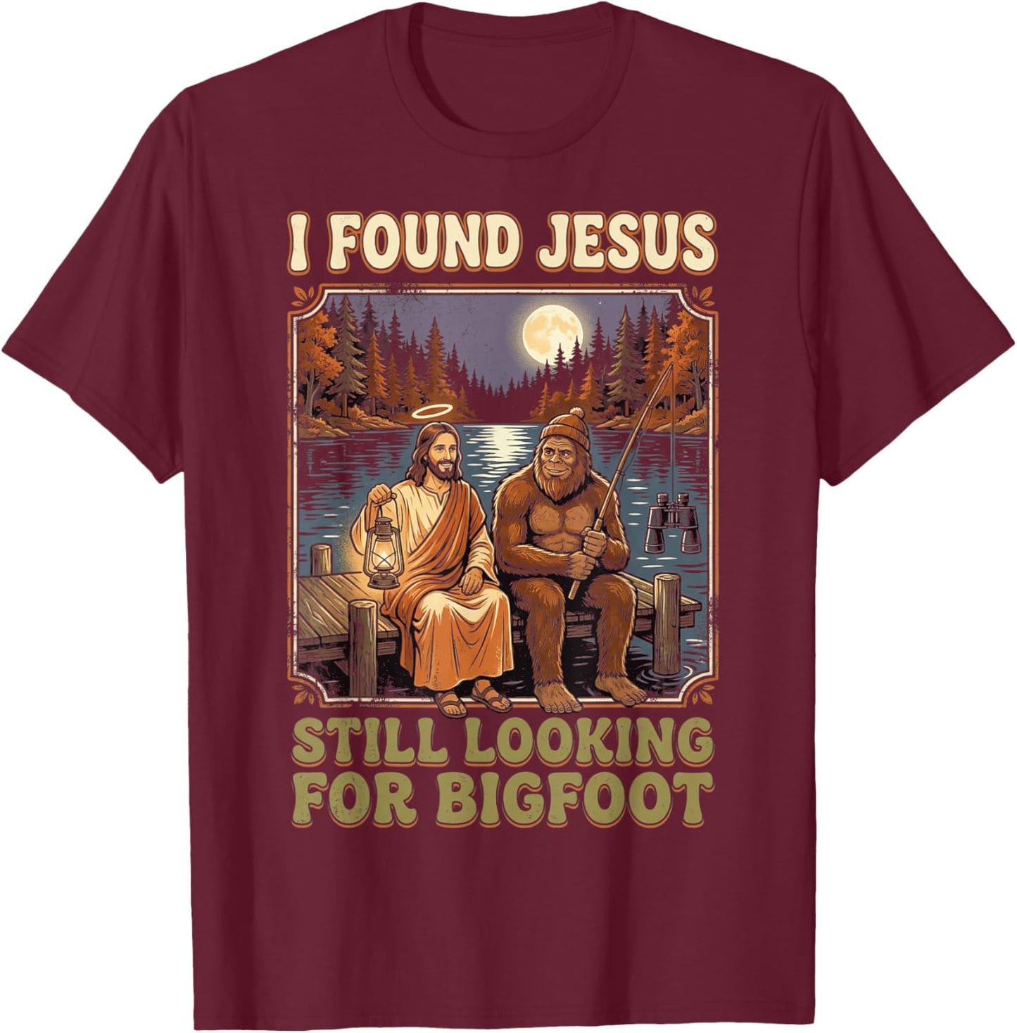 I Found Jesus Still Looking for Bigfoot Funny Sasquatch T-Shirt - T-Shirt | Maroon