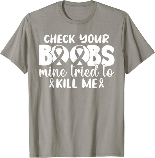 Check Your Boobs Mine Tried To Kill Me T-Shirt - T-Shirt | Sand