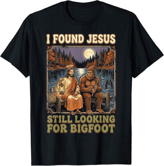 I Found Jesus Still Looking for Bigfoot Funny Sasquatch T-Shirt - T-Shirt | Black